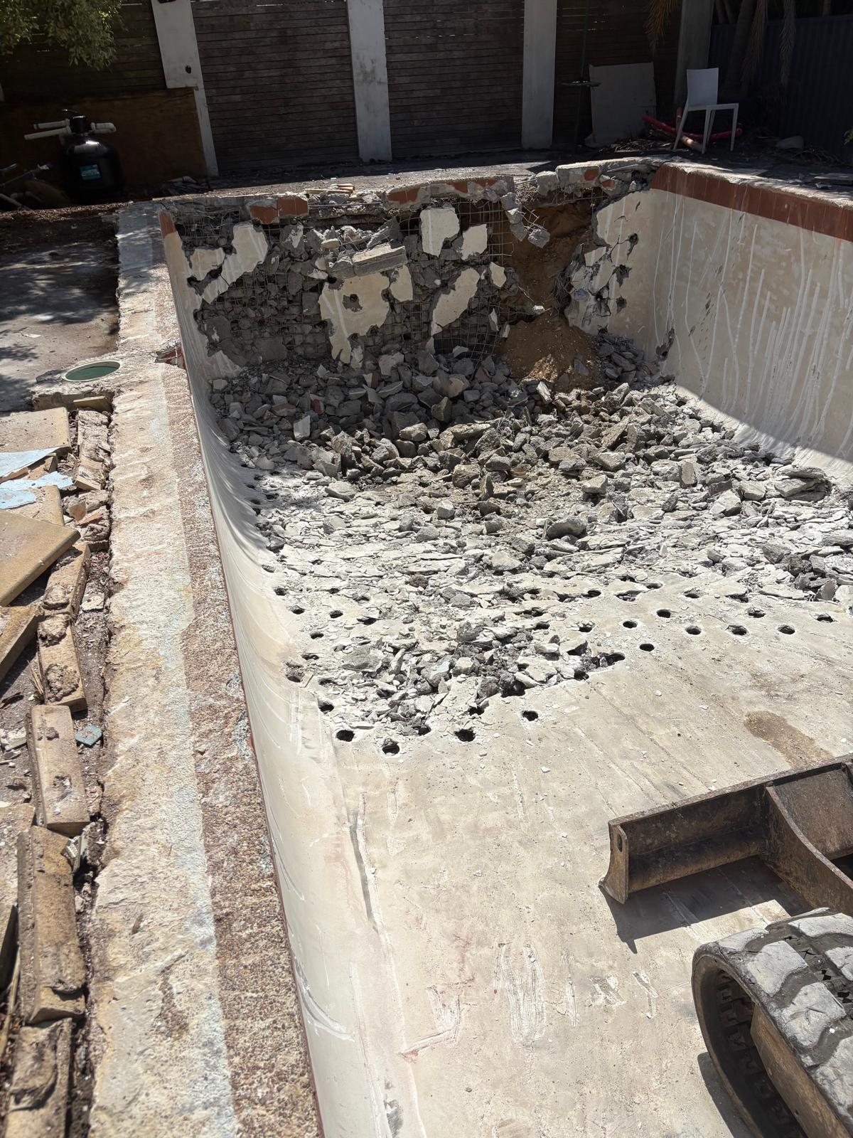 Concrete pool shell during removal