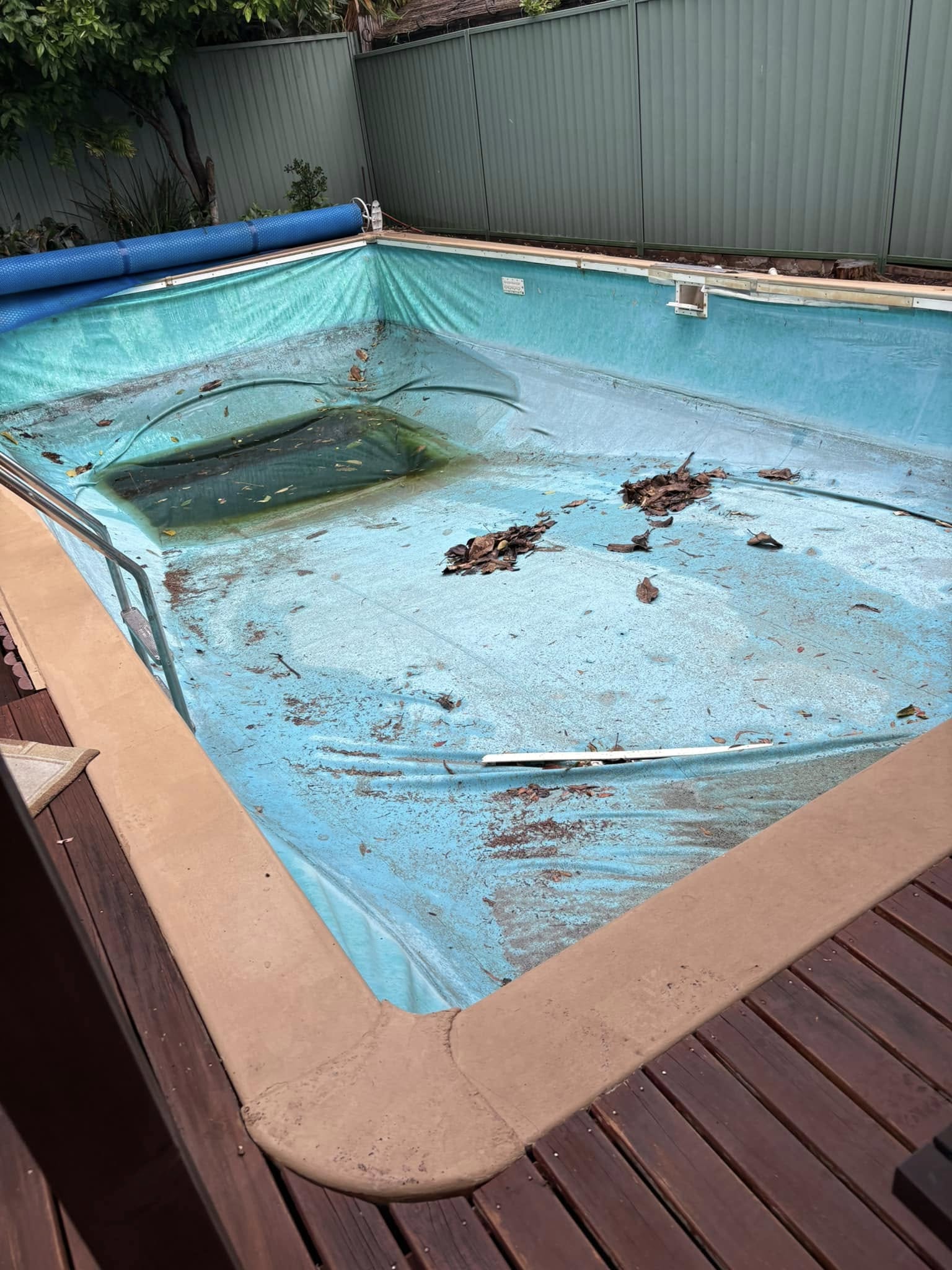 Empty residential swimming pool before removal